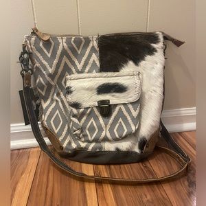 Cowhide and leather cross body purse